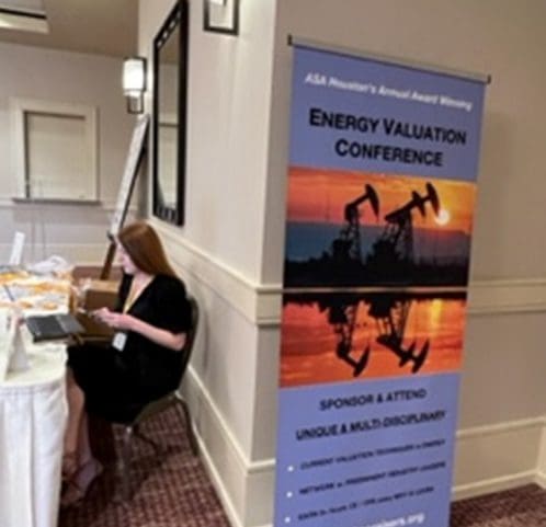 A vertical banner next to a woman sitting down