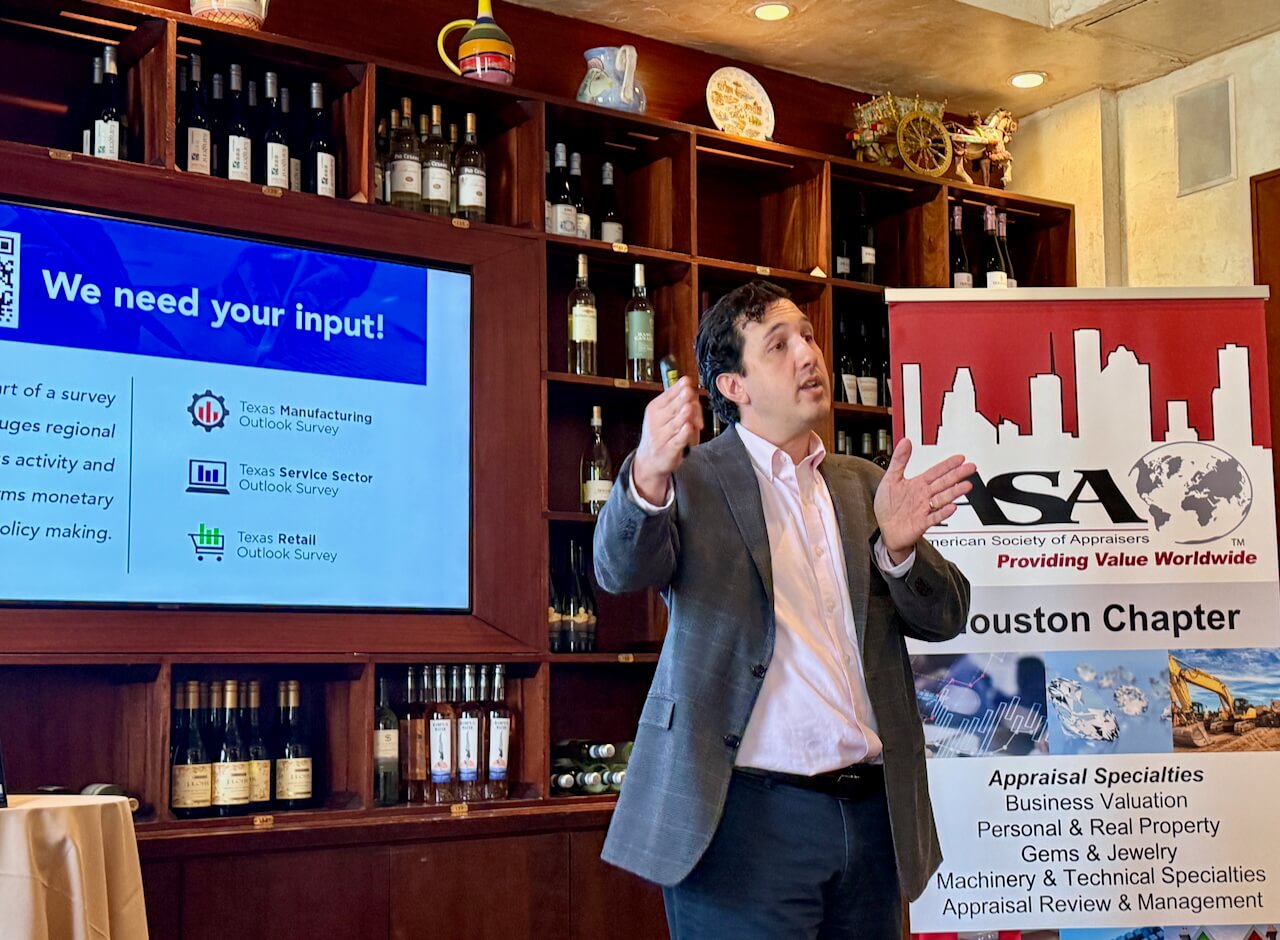 Man presenting at a business event.