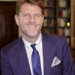 Smiling man in a purple suit. Smiling man in a purple suit.