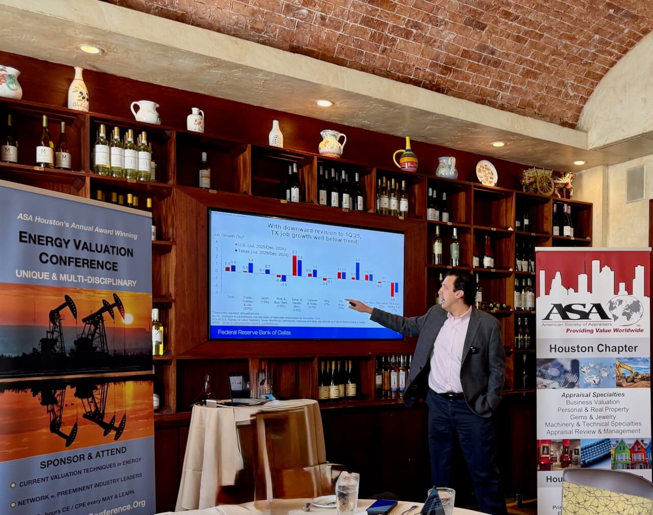 Man presenting at energy valuation conference.