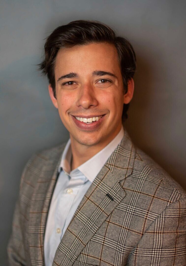 A man smiling for a photograph